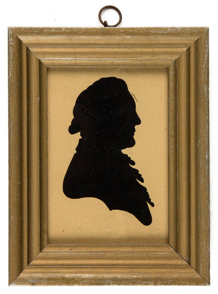 PEALE HOLLOW-CUT SILHOUETTE OF A GENTLEMAN: PEALE HOLLOW-CUT SILHOUETTE OF A GENTLEMAN, laid on a black fabric backing, embossed "Peale's Museum" in a banner below a spread-wing eagle. Housed under glass in a 19th-century molded wood frame with