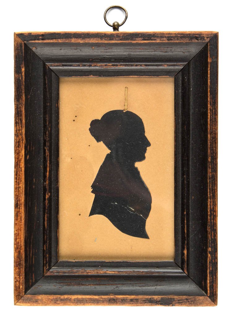 AMERICAN OR BRITISH SCHOOL (19TH CENTURY): AMERICAN OR BRITISH SCHOOL (19TH CENTURY) CUT-AND-PASTED SILHOUETTE OF A LADY, housed in a 19th-century molded wood frame with ebonized surface. Circa 1820-1840. 4 3/8" x 2 3/4" sight, 6 3/8" x 4 3/4"