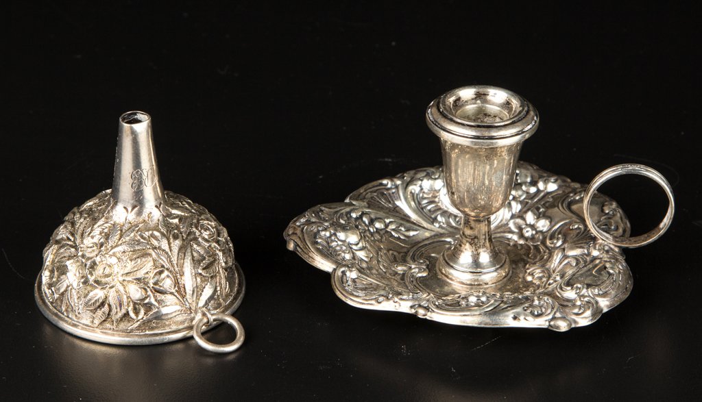 AMERICAN STERLING SILVER REPOUSSE ARTICLES, LOT OF TWO: AMERICAN STERLING SILVER REPOUSSE ARTICLES, LOT OF TWO, comprising a small funnel featuring densely chased floral and foliate decoration, marked "A. Jacobi & Co."; and a small chamberstick with leaf-f