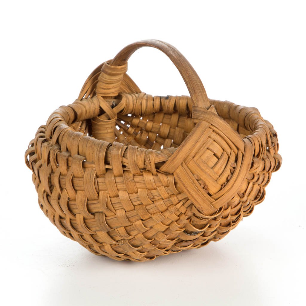 APPALACHIAN RIB-TYPE WOVEN-SPLINT DIMINUTIVE EGG BASKET: APPALACHIAN RIB-TYPE WOVEN-SPLINT DIMINUTIVE EGG BASKET, white oak, heavy melon-form with wrapped rim, low arched handle, and "God's Eye" handle supports. Original dry natural surface. First half 20th