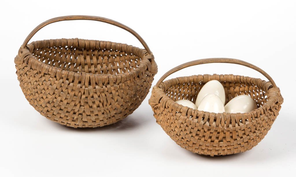 MID-ATLANTIC RIB-TYPE WOVEN-SPLINT EGG BASKETS, LOT OF: MID-ATLANTIC RIB-TYPE WOVEN-SPLINT EGG BASKETS, LOT OF TWO, white oak, each finely woven melon-form with wrapped rim, low arched handle, and U-shape handle supports. Original dry natural surface with 