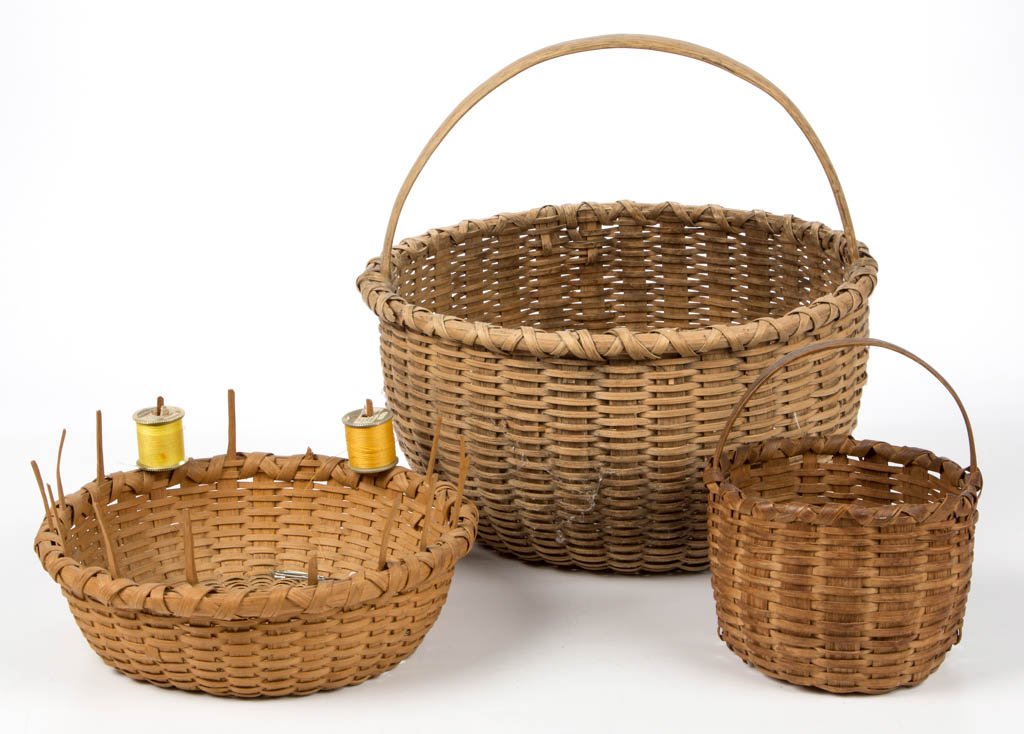 SHENANDOAH VALLEY OF VIRGINIA STAVE AND WOVEN-SPLINT: SHENANDOAH VALLEY OF VIRGINIA STAVE AND WOVEN-SPLINT BASKETS, LOT OF THREE, white oak, comprising two circular-form with wrapped rim and arched handle, and a low sewing basket with staves extended pas