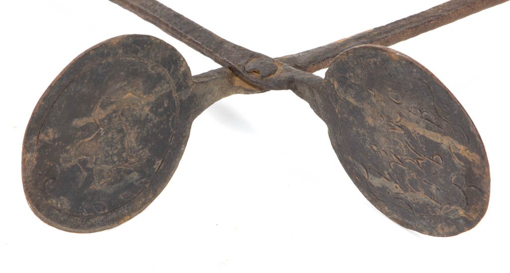 SIGNED AMERICAN WROUGHT-IRON WAFER IRON: SIGNED AMERICAN WROUGHT-IRON WAFER IRON, long-handle scissors style, the plates featuring a man with long pipe riding a horse on one side, and "H. P. B. / C. M. P. / ANNO / 1804" in reverse on the oth