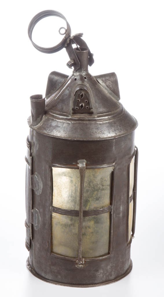 SHEET-IRON AND HORN HAND LANTERN / LANTHORNE: SHEET-IRON AND HORN HAND LANTERN / LANTHORNE, circular form with strap ring handle above the conical top fitted with three dormer-like vents and shirt chimney, body set with three horn panes. 18th/19t