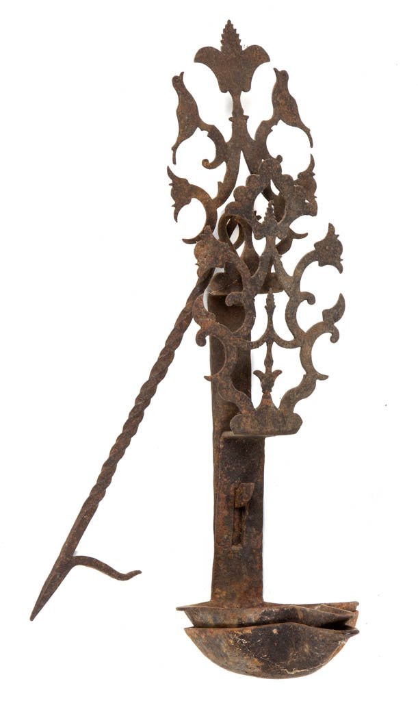 WROUGHT-IRON DOUBLE CRUISE FAT LAMP: WROUGHT-IRON DOUBLE CRUISE FAT LAMP, each pan with a front spout and ornate cut-out crest featuring tulips and birds, supported on a twisted-shaft hanging hook. 19th century. 18: HOA, 13 1/4" H crest.