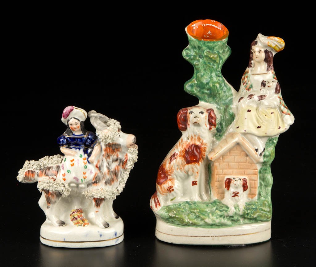 ENGLISH STAFFORDSHIRE FIGURES, LOT OF TWO: ENGLISH STAFFORDSHIRE FIGURES, LOT OF TWO, comprising girl riding a goat, on a low oval mound base, his coat painted in brushy stripes and ikat-type painting in orange and black, the girl dressed in b