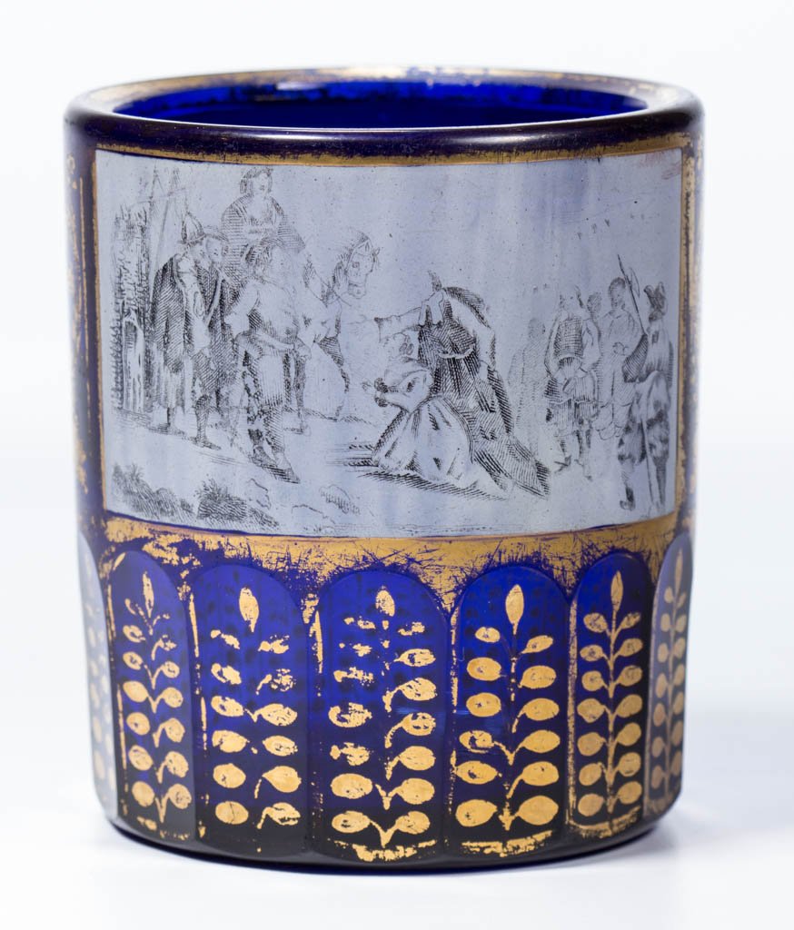 RUSSIAN CUT AND DECORATED HISTORICAL GLASS BEAKER /: RUSSIAN CUT AND DECORATED HISTORICAL GLASS BEAKER / TUMBLER, deep cobalt blue with gilt decoration, cylindrical form with two sides decorated en grisaille with a scene depicting a begging woman and ot