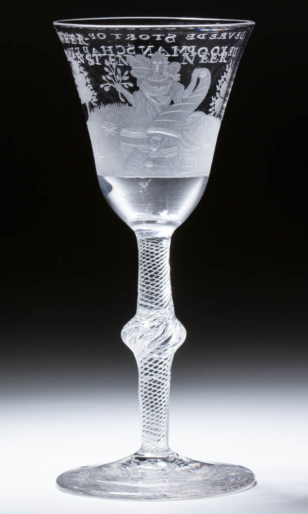 EUROPEAN FREE-BLOWN AND ENGRAVED AIR-TWIST STEM WINE: EUROPEAN FREE-BLOWN AND ENGRAVED AIR-TWIST STEM WINE GLASS, colorless lead glass, pointed round funnel bowl with female figure surrounded by barrels and other freightage, two-line inscription below ri