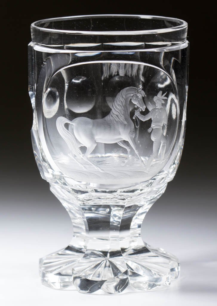 BOHEMIAN CUT AND ENGRAVED EQUESTRIAN FOOTED TUMBLER: BOHEMIAN CUT AND ENGRAVED EQUESTRIAN FOOTED TUMBLER, colorless non-lead glass, bowl featuring a reserve finely engraved with a horse and handler, small floral spray on reverse, raised on a seven-petal
