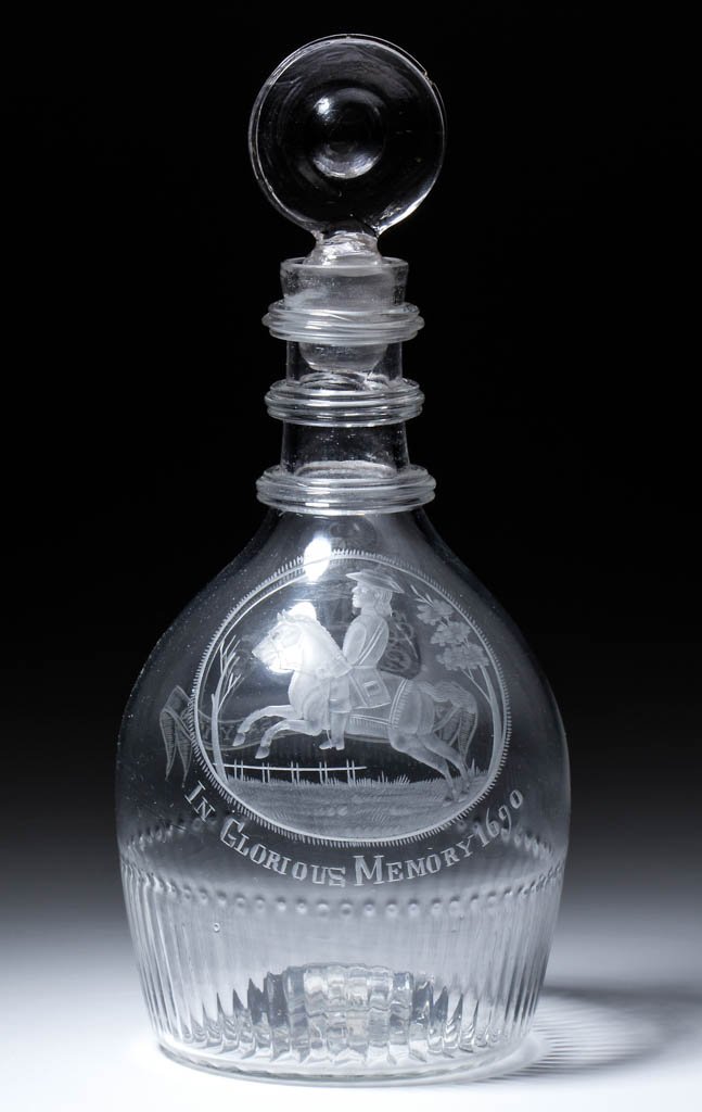 IRISH DIP-MOLDED AND ENGRAVED HISTORICAL QUART DECANTER: IRISH DIP-MOLDED AND ENGRAVED HISTORICAL QUART DECANTER, colorless lead glass, Prussian form featuring a depiction of King William on horseback above "IN GLORIOUS MEMORY 1690", reverse with crown abov