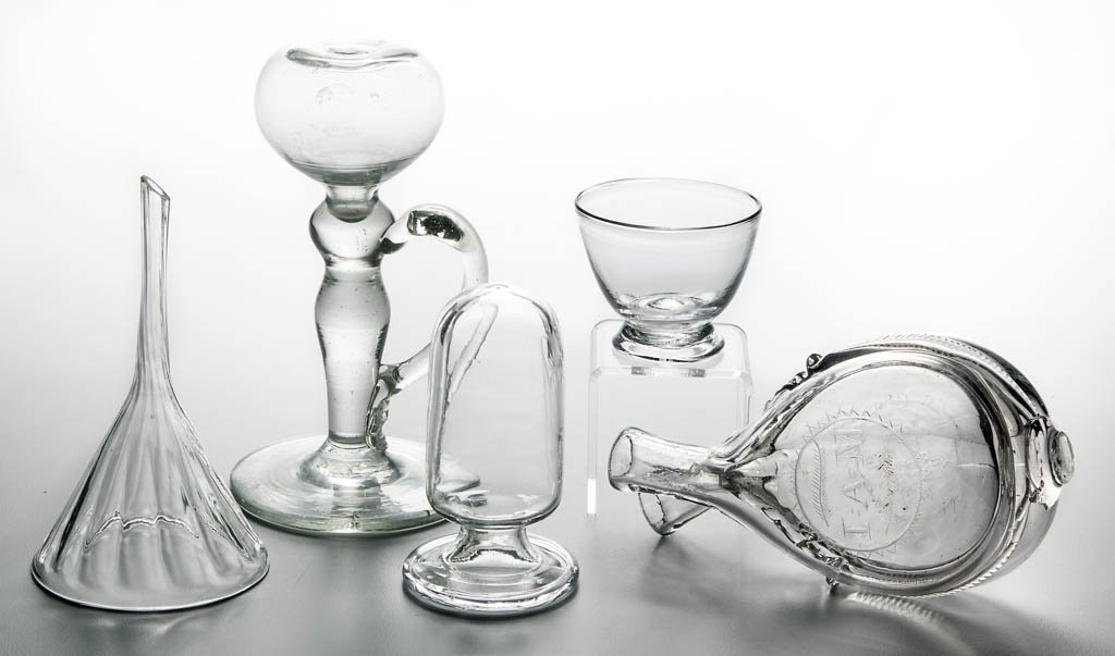 ASSORTED BLOWN ARTICLES, LOT OF FIVE: ASSORTED BLOWN ARTICLES, LOT OF FIVE, colorless lead and non-lead glass, including an engraved gemel flask/bottle, a whale oil lamp with applied handle, a footed open salt, and a pattern-molded funnel