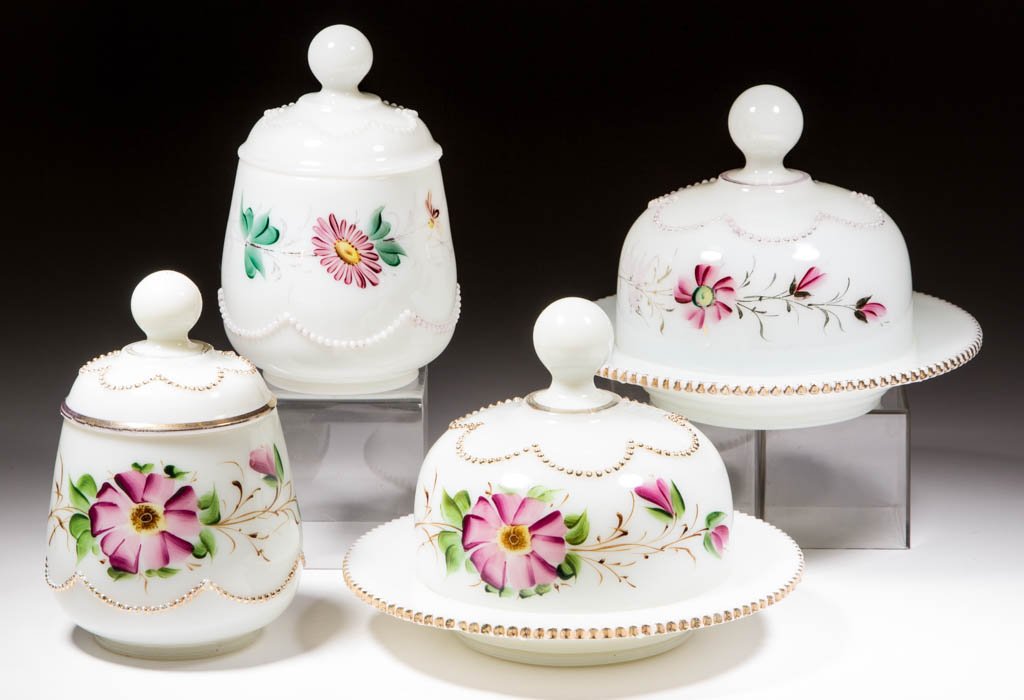 HEISEY NO. 1295 / BEADED SWAG TABLE ARTICLES, LOT OF: HEISEY NO. 1295 / BEADED SWAG TABLE ARTICLES, LOT OF FOUR, opaque white with gilt and polychrome-enamel decoration, comprising two covered butter dishes, and two covered sugar bowls. A. H. Heisey & Co