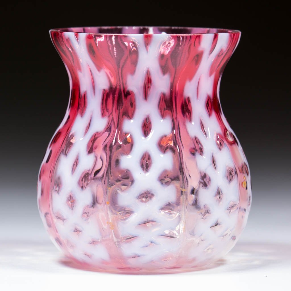 CRISS-CROSS TOOTHPICK HOLDER: CRISS-CROSS TOOTHPICK HOLDER, cranberry opalescent, factory polished rim. Consolidated Lamp & Glass Co. Circa 1894. 2 1/4" H.Literature: Parallels Bredehoft/Sanford - Glass Toothpick Holders, p. 46, m