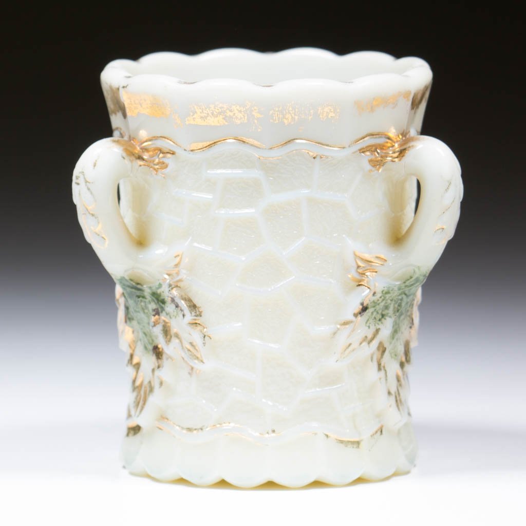 NORTHWOOD MAPLE LEAF TOOTHPICK HOLDER: NORTHWOOD MAPLE LEAF TOOTHPICK HOLDER, custard with green stain and gilt decoration. Northwood Glass Co./National Glass Co. Circa 1900. 2 1/4" HOA.Literature: Bredehoft/Sanford - Glass Toothpick Holde