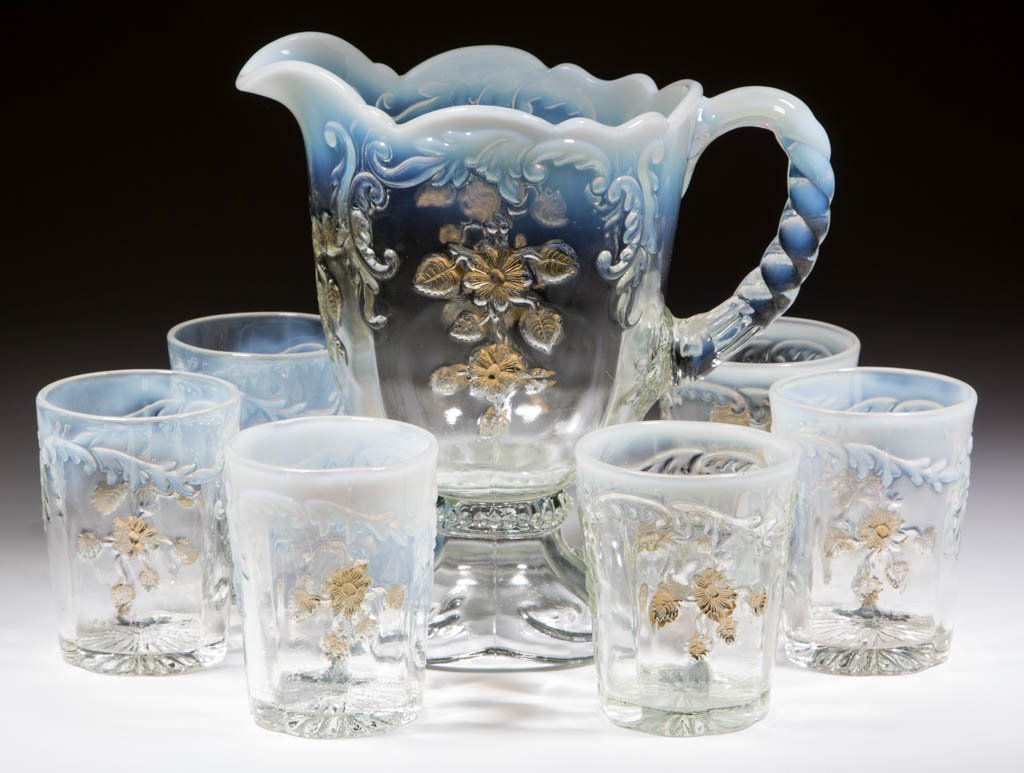 INTAGLIO SEVEN-PIECE WATER SET: INTAGLIO SEVEN-PIECE WATER SET, colorless opalescent, comprising a water pitcher and six tumblers with factory polished bases. Northwood Glass Co./Dugan Glass Co. Late 19th/early 20th century. 3 5/8" 