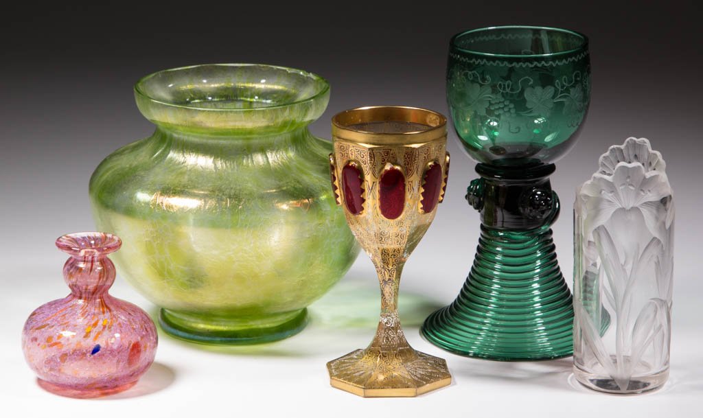 ASSORTED ART GLASS ARTICLES, LOT OF FIVE: ASSORTED ART GLASS ARTICLES, LOT OF FIVE, comprising a colorless Moser intaglio cut cabinet vase, an ornate gilt decorated Moser wine with ruby-stained panels, a Loetz-type vase with green Papillon-st