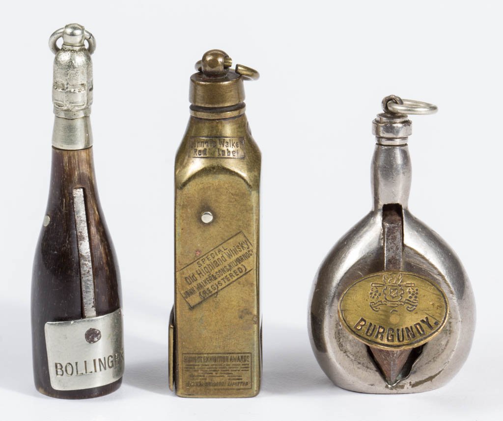 FIGURAL SPIRITS BOTTLES CIGAR CUTTERS, LOT OF THREE (1 of 1)