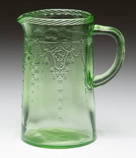 CAMEO DEPRESSION GLASS MILK PITCHER: CAMEO DEPRESSION GLASS MILK PITCHER, green. Hocking Glass Co. 1930-1934. 6" H.Literature: Mauzy - Mauzy's Depression Glass, p. 31, top right.Provenance: From the Collection of Harold Humphrey of Mt. C