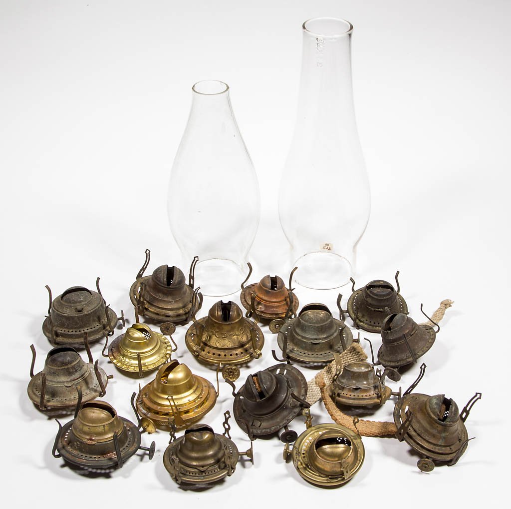 ASSORTED SLIP BURNERS AND CHIMNEYS, LOT OF 18: ASSORTED SLIP BURNERS AND CHIMNEYS, LOT OF 18, comprising two No. 1 chimneys, one embossed "C. & S. LEAD GLASS" and the other "DUPLEX", and various No. 0 and No. 1 burners. Fourth quarter 19th/first q