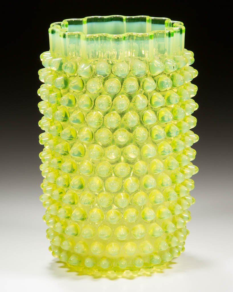 HOBBS NO. 323 DEW DROP / HOBNAIL CELERY VASE: HOBBS NO. 323 DEW DROP / HOBNAIL CELERY VASE, Canary / Vaseline (black lighted) opalescent, ruffled rim, polished pontil mark. Hobbs, Brockunier & Co. Circa 1886. 6" H.Literature: Parallels Bredehofts