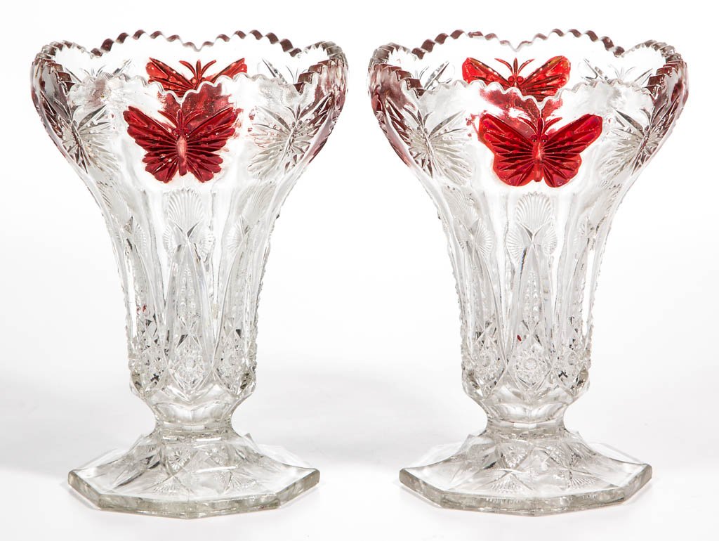 BUTTERFLY - RUBY-STAINED VASES, LOT OF TWO: BUTTERFLY - RUBY-STAINED VASES, LOT OF TWO, colorless. Maker unverified. Fourth quarter 19th century. 6 1/4" HOA. Provenance: From the collection of the late Ed Kleppinger of New Orleans, LA.