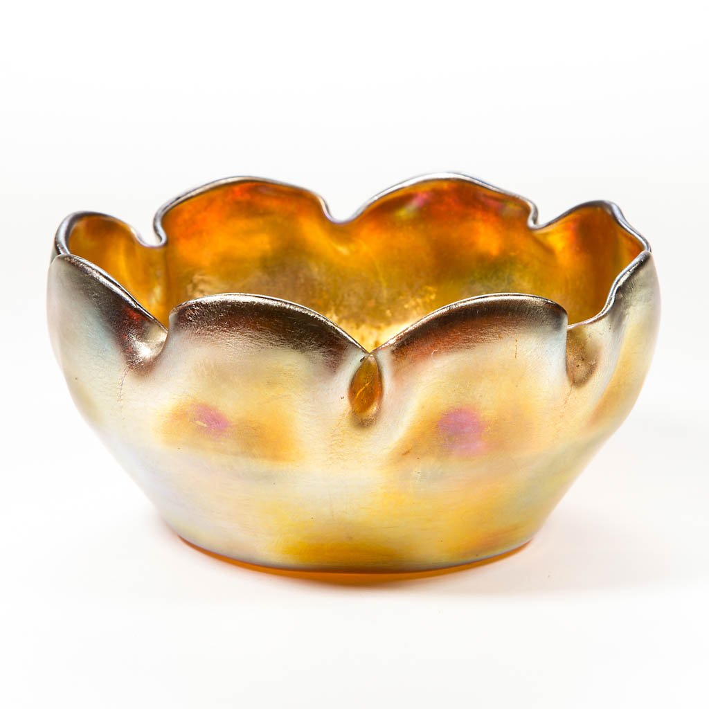 TIFFANY FAVRILE SCALLOPED FINGER BOWL: TIFFANY FAVRILE SCALLOPED FINGER BOWL, gold iridescent, cupped form molded with eight ribs, scalloped rim, signed "L. C. T." under the polished base, polished pontil mark. Tiffany Studios. First quart