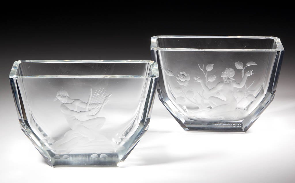 ENGRAVED STUDIO ART GLASS BOWLS, LOT OF TWO: ENGRAVED STUDIO ART GLASS BOWLS, LOT OF TWO, colorless, comprising a Man playing a lyre and a woman picking flowers; each signed. Possibly Sweden. 20th century. 5 1/4" H, 7 7/8" x 3 3/8". Man with lyr