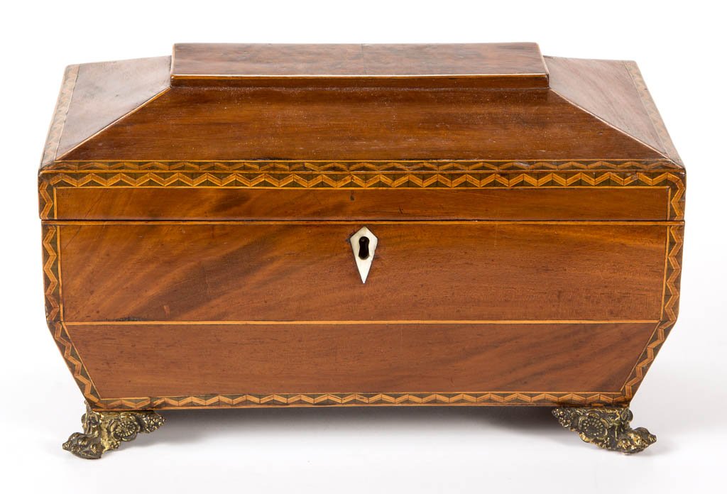 REGENCY INLAID MAHOGANY JEWELRY CASKET: REGENCY INLAID MAHOGANY JEWELRY CASKET, sarcophagus-form, the hinged lid concealing an interior with original paper lining and removable fitted tray, simple and complex line-inlaid decoration througho