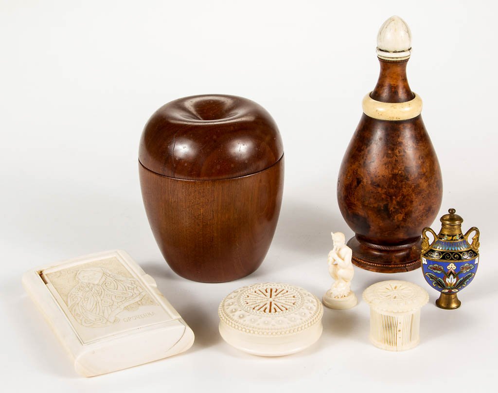 ASSORTED TURNED, CARVED, AND ENAMELED ARTICLES, LOT OF: ASSORTED TURNED, CARVED, AND ENAMELED ARTICLES, LOT OF SEVEN, including an English burlwood talcum shaker with threaded top and foot, a French enameled gilt-brass scent flask, and four carved bone art