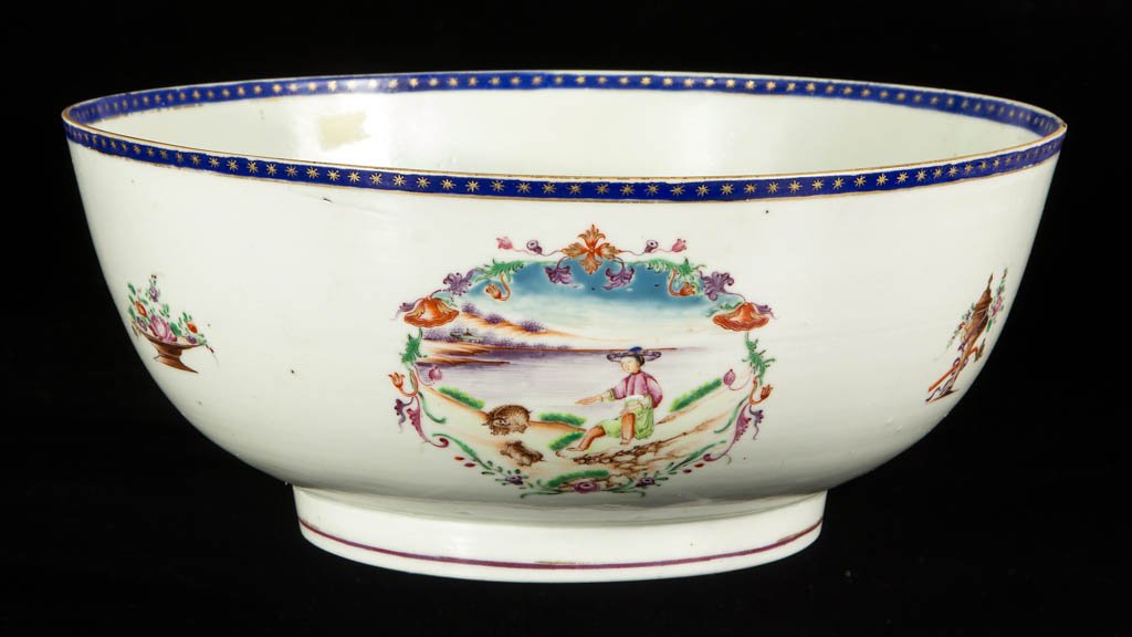 CHINESE EXPORT PORCELAIN BOWL: CHINESE EXPORT PORCELAIN BOWL, blue floral spray with gilt and red sunburst on interior base, interior and exterior rim have band of blue with gilt painted stars, exterior has cartouches with polychro