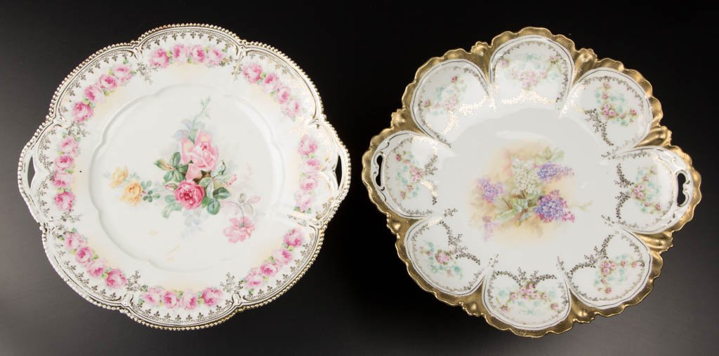 R.S. PRUSSIA PORCELAIN CAKE PLATES, LOT OF TWO: R.S. PRUSSIA PORCELAIN CAKE PLATES, LOT OF TWO, comprising one RSP mold 256 with gilding, lilac blossom and rose garland decoration, and one RSP mold 202 with floral decoration and gilding. Each marke