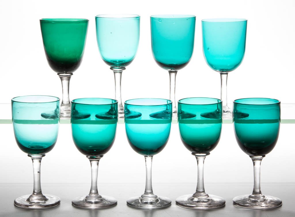 FREE-BLOWN COLORED BOWL WINE GLASSES, ASSEMBLED SET OF: FREE-BLOWN COLORED BOWL WINE GLASSES, ASSEMBLED SET OF EIGHT, each bowl in varying shades of teal green, raised on a colorless stem and plain foot. Together with a similar example with polished pontil
