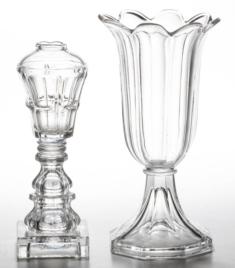 PRESSED BIGLER WHALE OIL / FLUID STAND LAMP: PRESSED BIGLER WHALE OIL / FLUID STAND LAMP, colorless, dome-top conical font, raised on a double-ogee standard and square base, wafer construction, lacking collar. Together with a colorless Sandwich