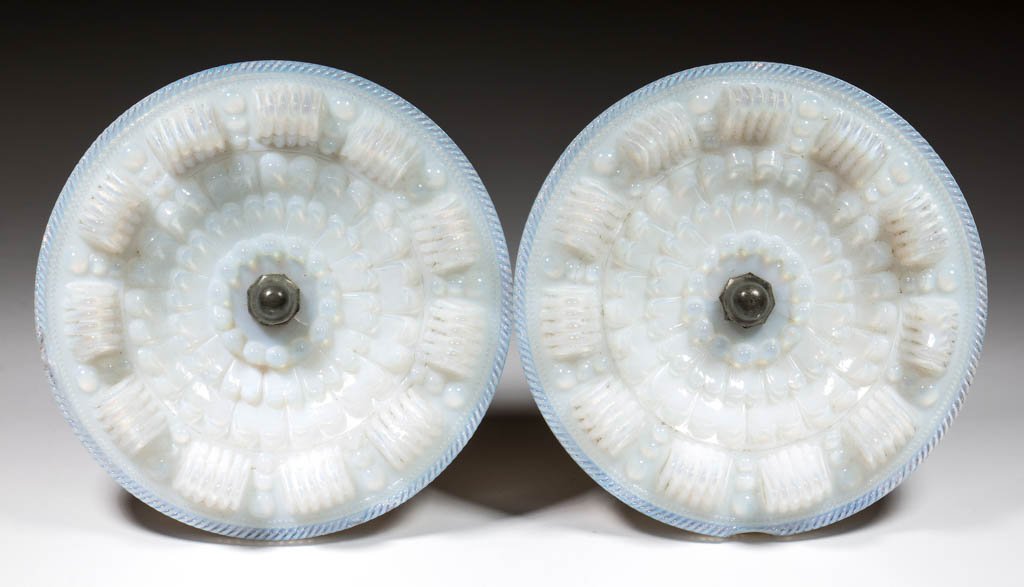PRESSED SPLIT-PETAL ROSETTE PAIR OF CURTAIN PINS: PRESSED SPLIT-PETAL ROSETTE PAIR OF CURTAIN PINS, deep fiery opalescent, each with a circular rope-edge rim front and back, two additional rope rings to reverse, and original Britannia shanks. Boston 