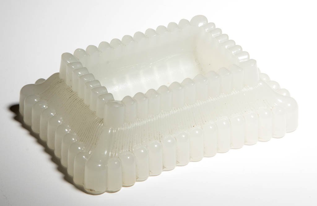 SANDWICH PRESSED RIBBED / ONION MATCH TRAY: SANDWICH PRESSED RIBBED / ONION MATCH TRAY, alabaster/clambroth, rectangular form with a ribbed gallery, deep concave well, striker sides and a ribbed base. Boston & Sandwich Glass Co. 1860-1880. 1 1/