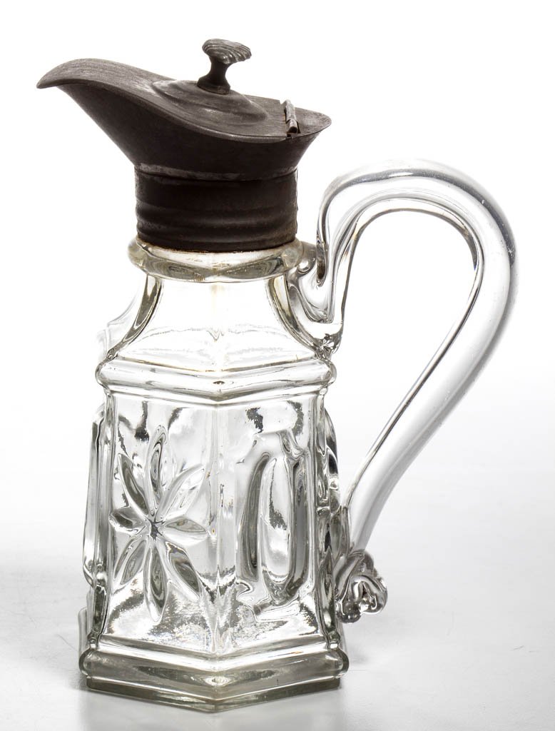 BLOWN-MOLDED BUCKLE AND STAR / TAYLOR (OMN) MOLASSES: BLOWN-MOLDED BUCKLE AND STAR / TAYLOR (OMN) MOLASSES CAN / JUG, colorless, slightly tapered hexagonal body featuring an alternating pattern on each panel, applied hollow handle, and plain base. Origin