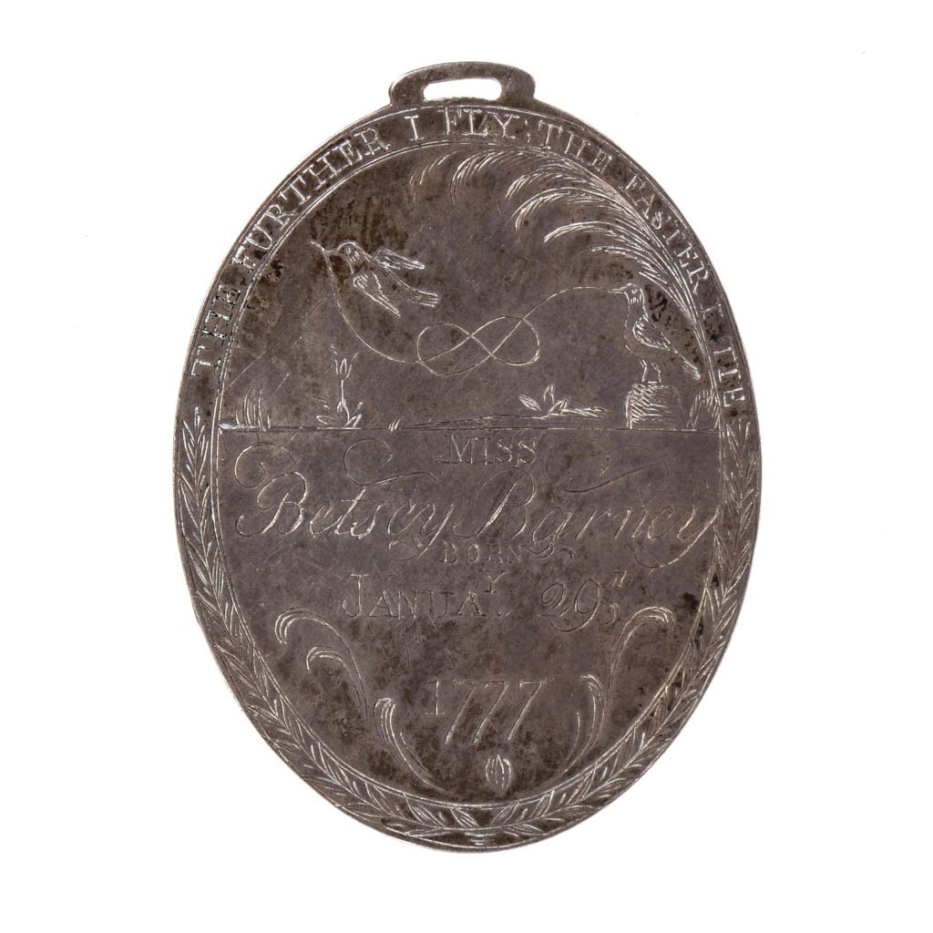 AMERICAN ENGRAVED COIN SILVER BIRTH AND MOTTO PENDANT: AMERICAN ENGRAVED COIN SILVER BIRTH AND MOTTO PENDANT, oval form with hanger at top, one side with doves above "Miss Betsey Barney, Born Janua'y 29th 1777", the reverse with flowers, bees, and beehive