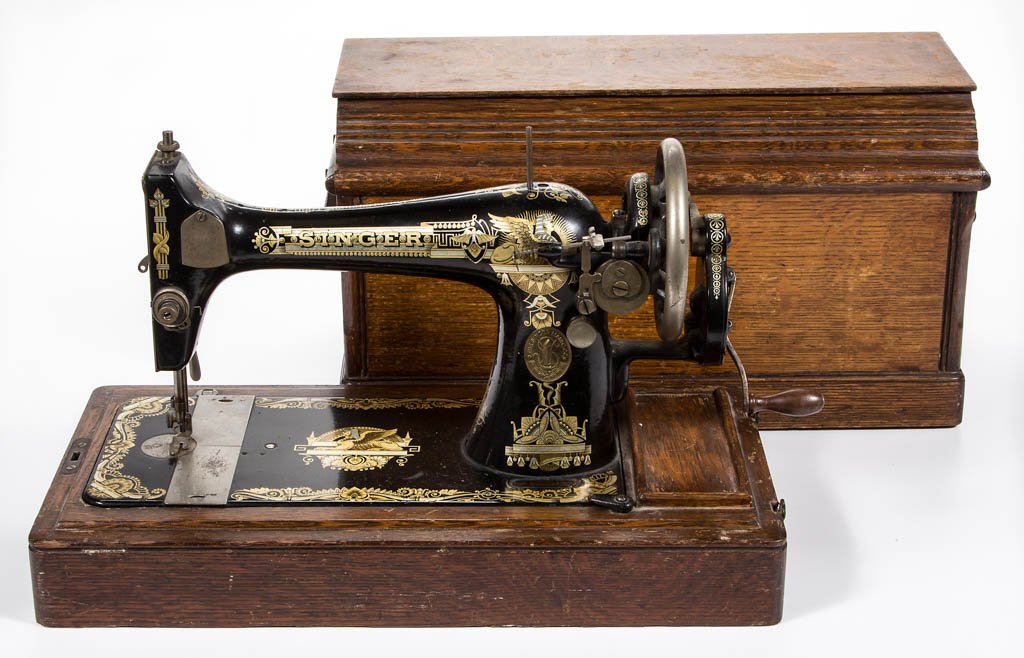 SINGER MODEL NO. 127 PORTABLE TABLE-TOP HAND-CRANK: SINGER MODEL NO. 127 PORTABLE TABLE-TOP HAND-CRANK SEWING MACHINE, original black paint with gilt Memphis Sphinx decorations and manufacturer's names on cast metal frame, brass maker's plate, mounted