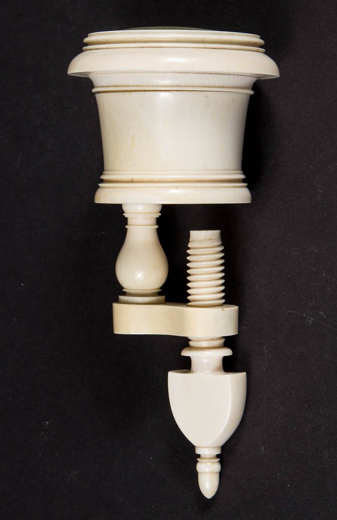 BONE SEWING CLAMP WITH PIN CUSHION: BONE SEWING CLAMP WITH PIN CUSHION, clamp mechanism supports a cylinder-form container with pin cushion top, interior of container fitted with a thimble holder and additional storage, tip of clamp thu