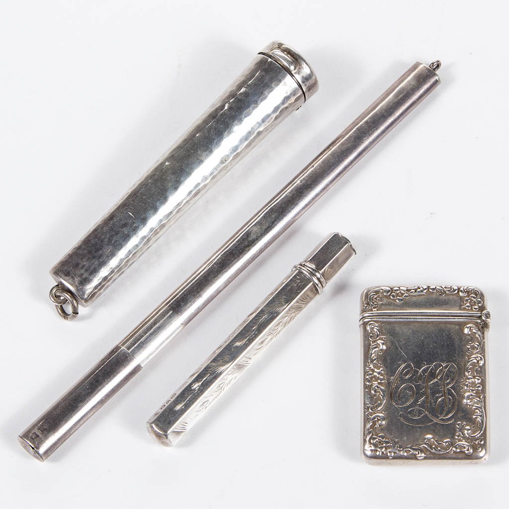 STERLING SILVER NEEDLE CASES, LOT OF FOUR: STERLING SILVER NEEDLE CASES, LOT OF FOUR, comprising three cylinder-form examples, including two with lift-off covers, one example with hexagonal and engraved foliage pattern, marked for Villiers & J
