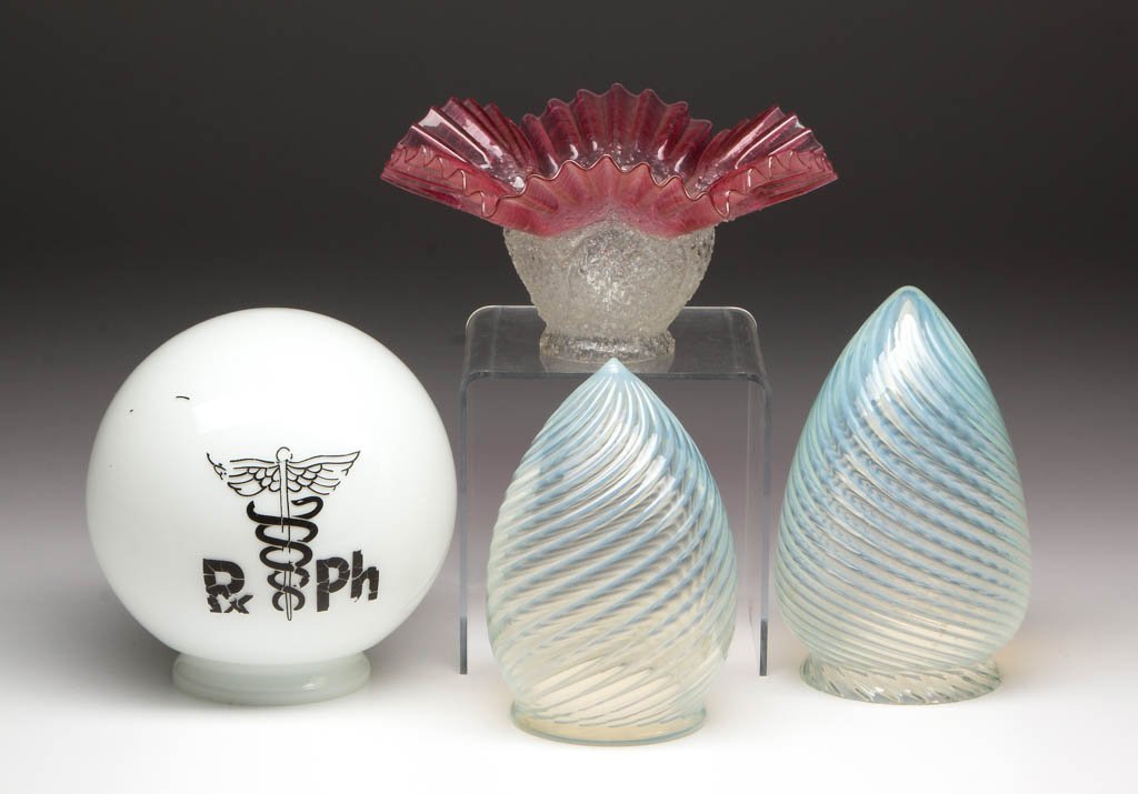 ASSORTED PATTERNS LAMP SHADES, LOT OF FOUR: ASSORTED PATTERNS LAMP SHADES, LOT OF FOUR, comprising two colorless opalescent swirl conical-form examples, an opaque white ball-form example with "Px Ph" and physician's emblem, and a rubina oversho