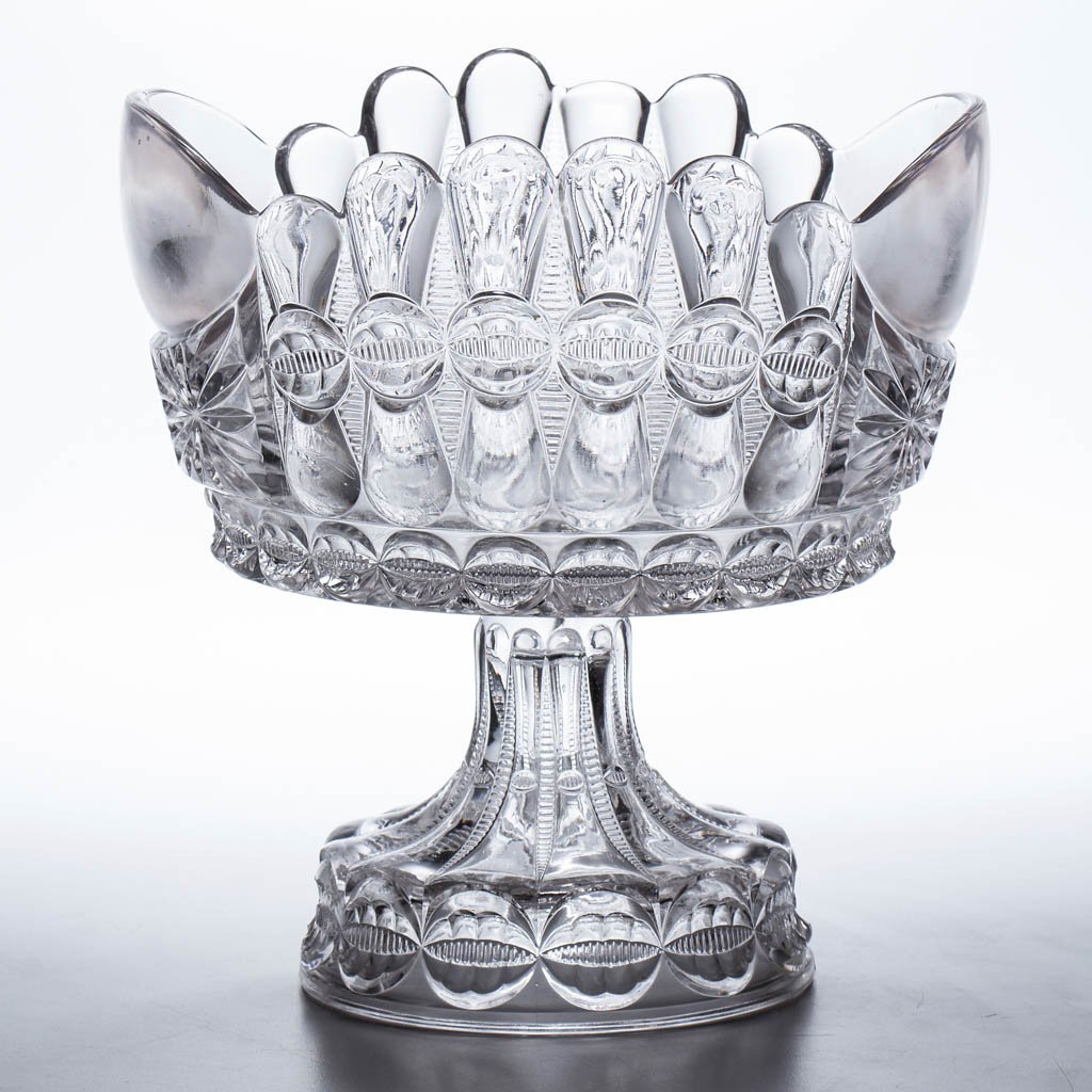 BOWTIE / THOMPSON NO. 18 ORANGES / PUNCH BOWL: BOWTIE / THOMPSON NO. 18 ORANGES / PUNCH BOWL, colorless, on high standard. Thompson Glass Co. Ltd. Circa 1889. 10 3/8" HOA, 10 1/4" D. Undamaged. Provenance: From the collection of the late James S. 