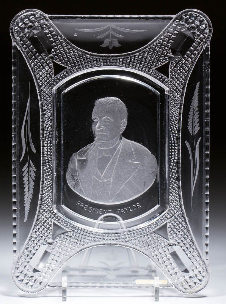 PRESIDENT TAYLOR BREAD TRAY: PRESIDENT TAYLOR BREAD TRAY, colorless with engraved decoration, rim with Curtain Tie Back pattern. Circa 1880. 7 1/2" x 11".Undamaged with only a hint of mold roughness to the edge, as made.Literatur