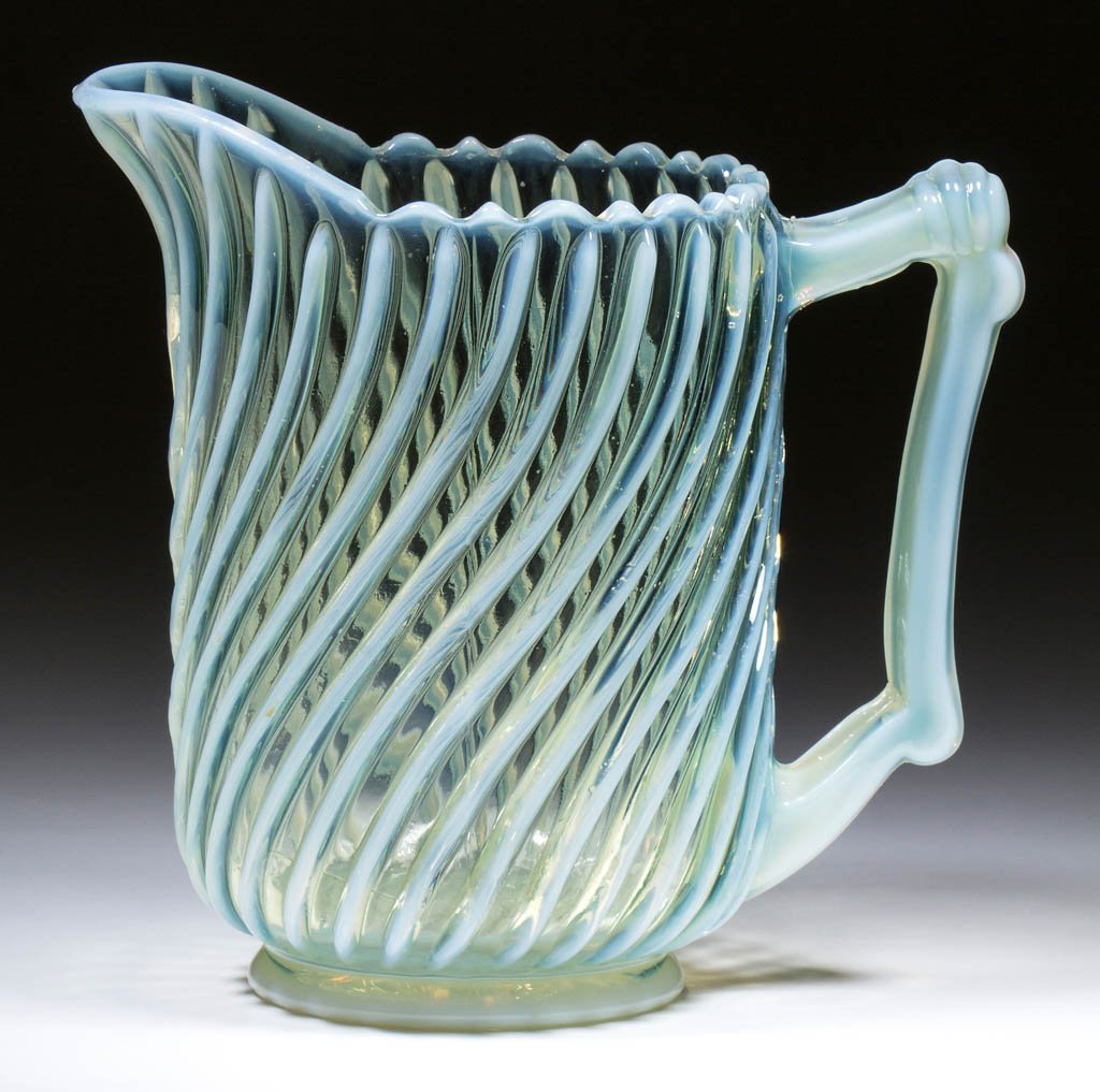 BEATTY SWIRL WATER PITCHER: BEATTY SWIRL WATER PITCHER, colorless opalescent with a yellow tint. A. J. Beatty & Sons. Circa 1889. 7 5/8" HOA. Undamaged. Provenance: From the collection of the late Ed Kleppinger of New Orleans, L