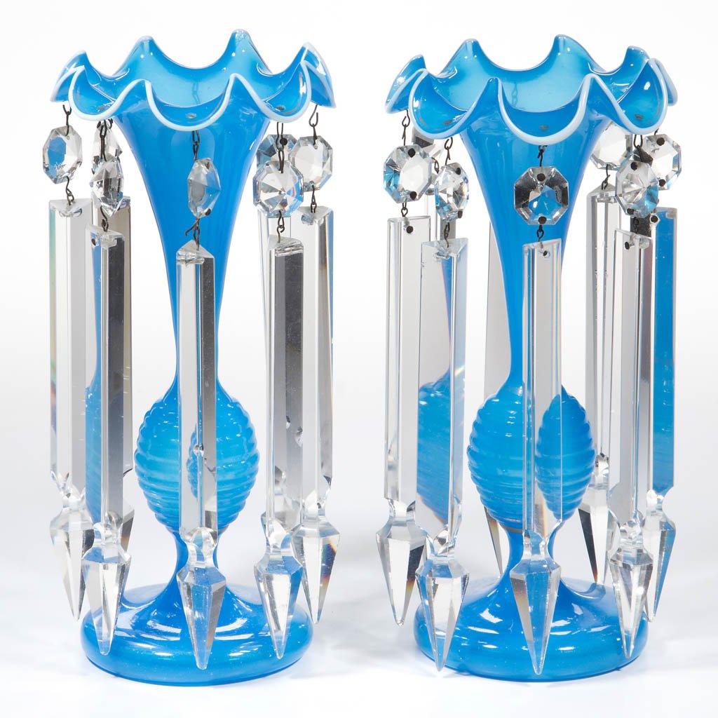 EUROPEAN OPALINE PAIR OF MANTLE LUSTERS: EUROPEAN OPALINE PAIR OF MANTLE LUSTERS, translucent starch blue with applied opal rims, each trumpet form top featuring a ruffled rim hung with eight matching long prisms, raised on a beehive-like st