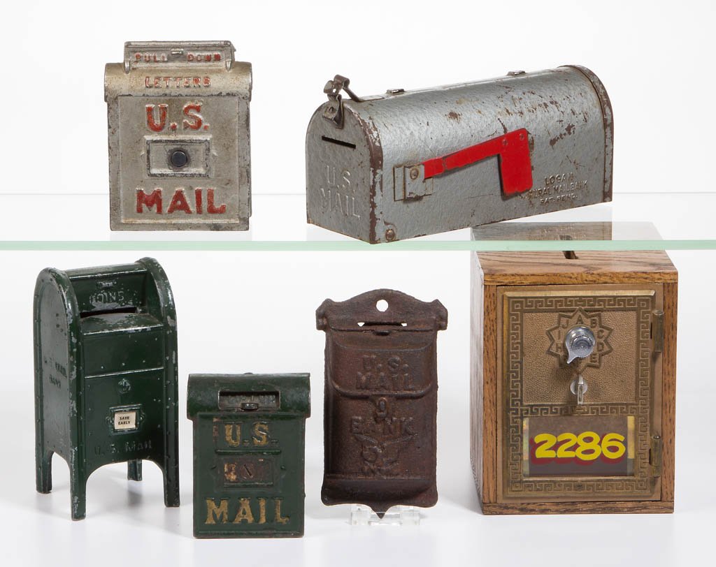 ASSORTED MIXED METAL PENNY BANKS, LOT OF SIX: ASSORTED MIXED METAL PENNY BANKS, LOT OF SIX, comprising various mailbox forms including one post office box modified into a bank. 20th century. 3 1/2" to 5 1/2" H.Good condition overall with wear to
