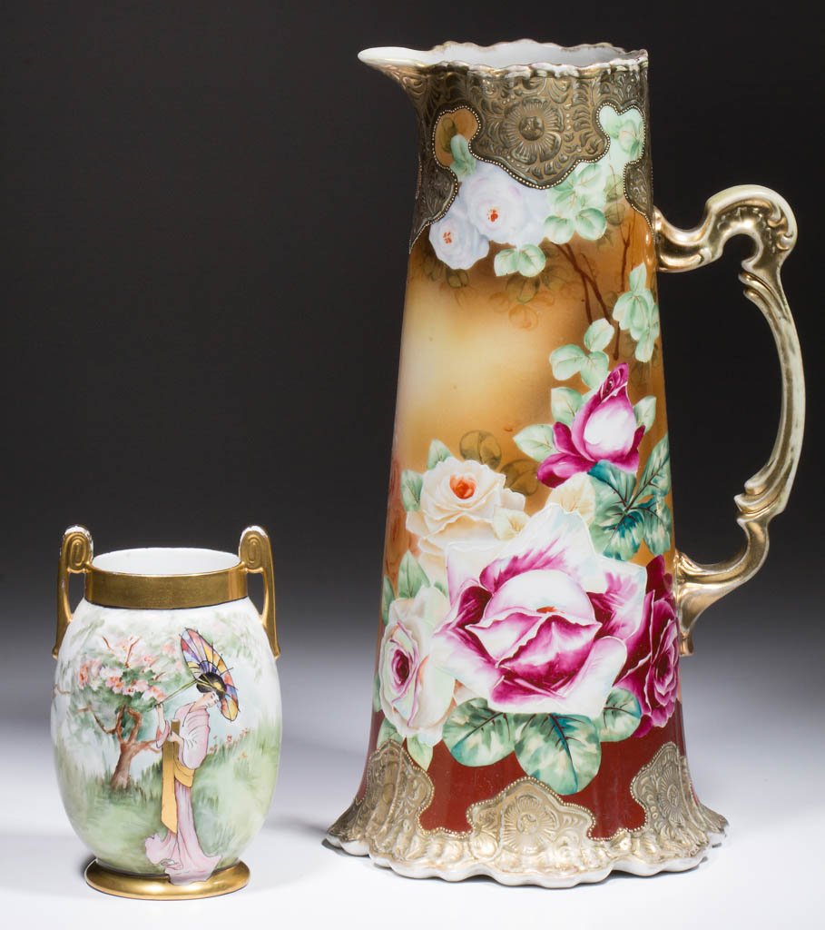 JAPANESE NIPPON NORITAKE CERAMIC ARTICLES, LOT OF TWO: JAPANESE NIPPON NORITAKE CERAMIC ARTICLES, LOT OF TWO, comprising one tall pitcher having a molded handle, rim, and foot, with embossed gilt decoration and polychrome floral decoration; and one bulbou