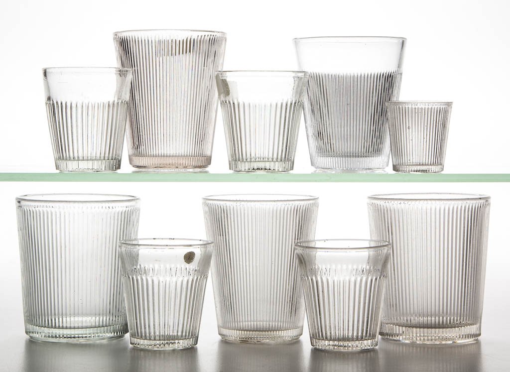 FINE RIB / REEDED (OMN) / PRISM TUMBLERS, LOT OF TEN: FINE RIB / REEDED (OMN) / PRISM TUMBLERS, LOT OF TEN, colorless lead and non-lead glass, comprising four tapered whiskey tumblers with wide plain band at rim, one tapered water tumbler with wide plain
