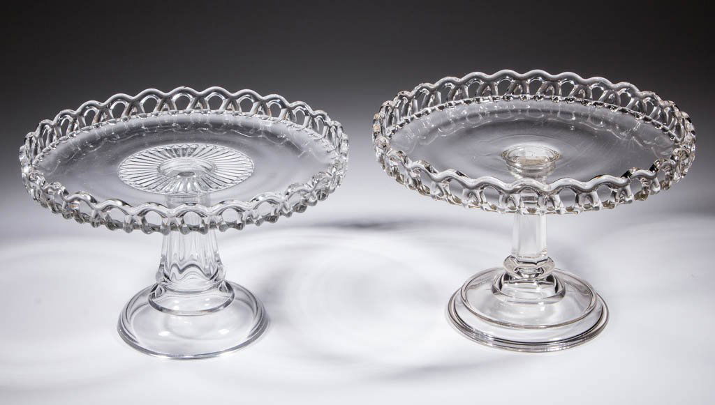 CROCHETED SKIRT / NR 33 SALVERS / CAKE STANDS, LOT OF: CROCHETED SKIRT / NR 33 SALVERS / CAKE STANDS, LOT OF TWO, colorless, each with an applied edge, differing sized hexagonal standards, one with a domed foot, other with a plateaued circular foot. Co-Op