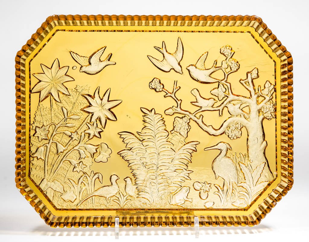 HUMMINGBIRD TRAY: HUMMINGBIRD TRAY, amber. Probably Beaver Falls Glass Co. Circa 1887. 10" x 13".Undamaged.Provenance: From a Tennessee private collection.
